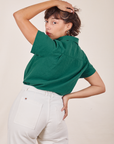 Angled back view of Pantry Button-Up in Hunter Green worn by Tiara
