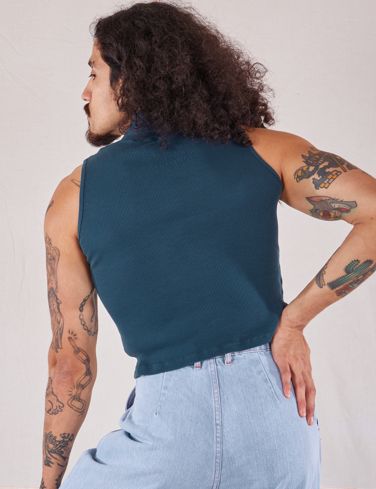 Sleeveless Essential Turtleneck in Lagoon back view on Jesse