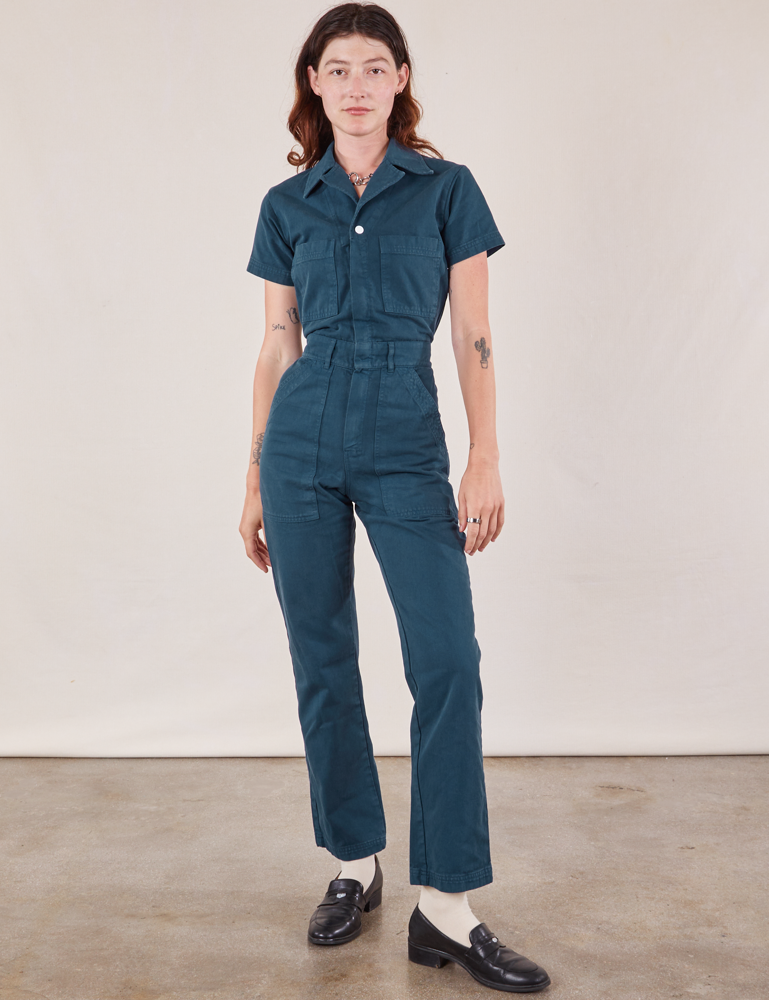 Alex is 5&#39;8&quot; and wearing XS  Short Sleeve Jumpsuit in Lagoon