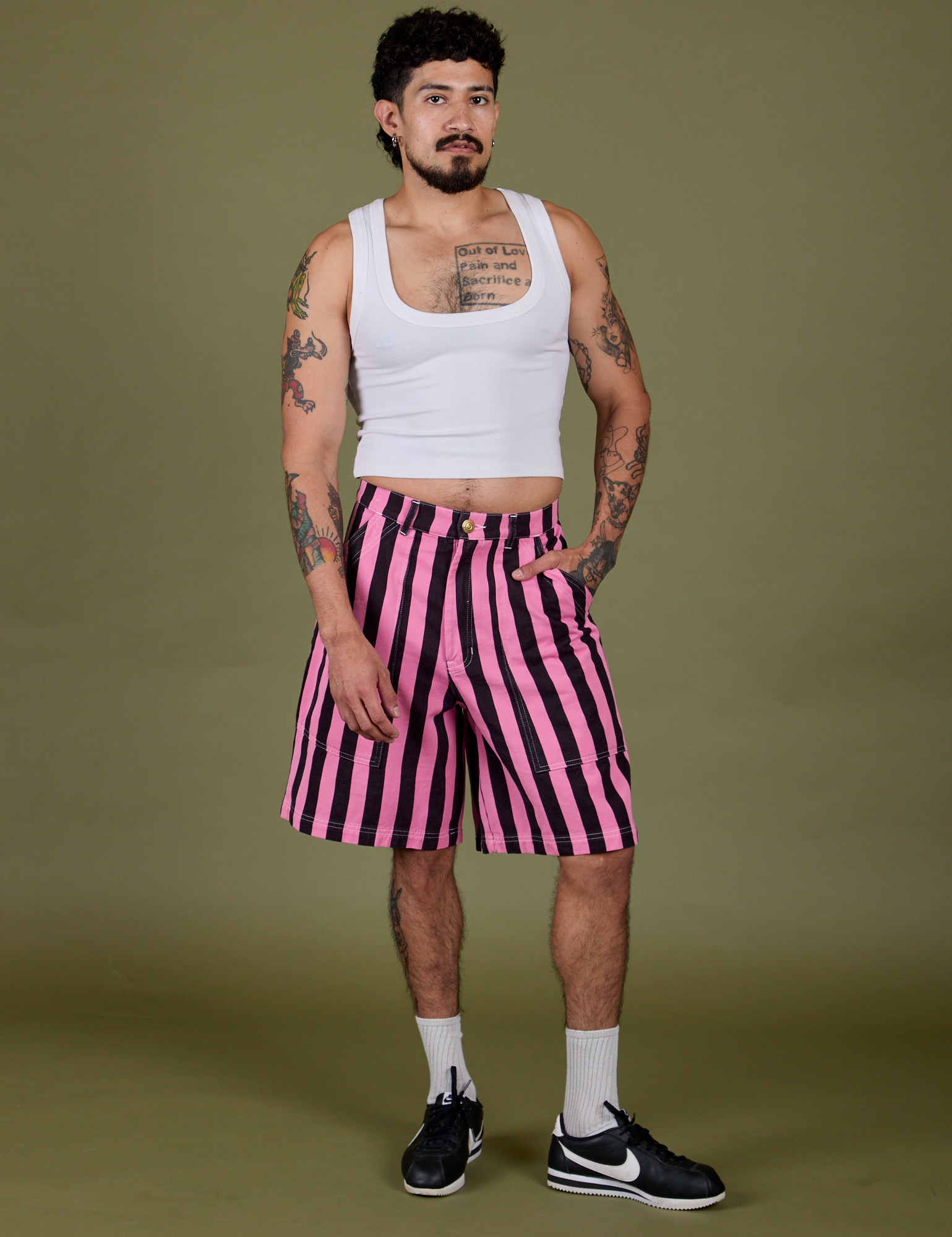Jesse is 5’8” and wearing S Longline Work Shorts in Bubblegum Pink paired with a vintage tee white Cropped Tank