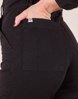 Long Sleeve Jumpsuit in Basic Black back pocket close up on Alex