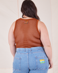 Back view of Mesh Tank Top in Burnt Terracotta and light wash Frontier Jeans worn by Ashley
