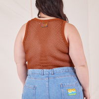 Back view of Mesh Tank Top in Burnt Terracotta and light wash Frontier Jeans worn by Ashley