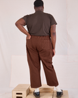 Back view of Mid-Rise Work Pants in Fudgesicle Brown and espresso brown Organic Vintage Tee on Elijah