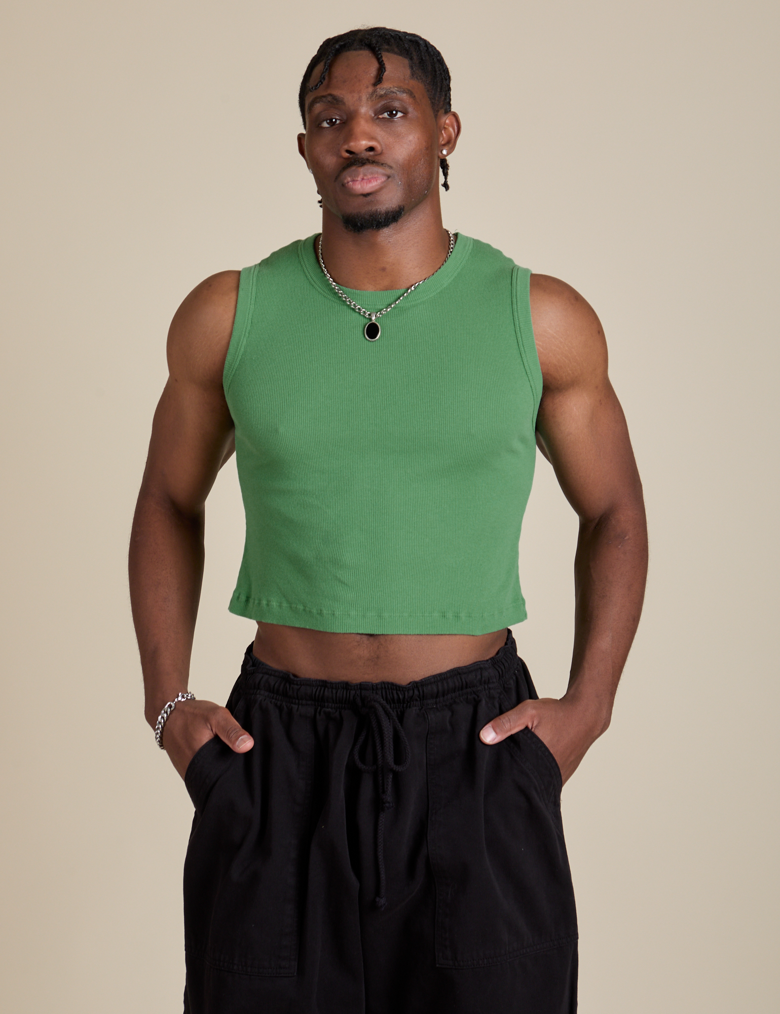 Isaac is 5’10” and wearing S Muscle Tee in Seafoam Green