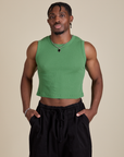 Isaac is 5’10” and wearing S Muscle Tee in Seafoam Green