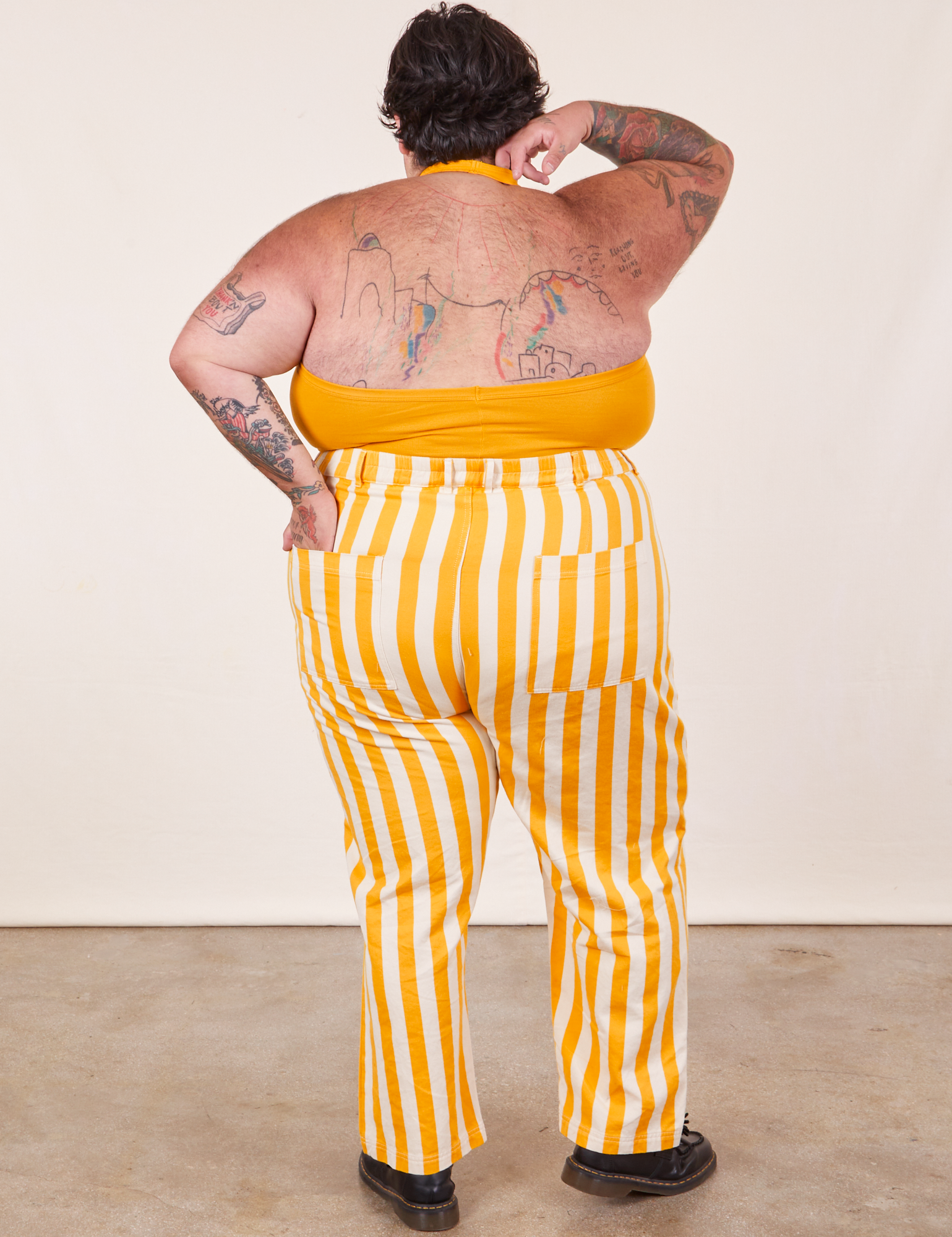 Back view of Work Pants in Lemon Stripe and mustard yellow Halter Top on Sam