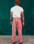 Back view of Stripe Work Pants in Cherry Candy and Organic Vintage Tee Off-White on Issac