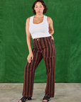 Tiara is wearing Black Stripe Work Pants in Fudgesicle Brown and Cropped Tank in vintage tee off-white