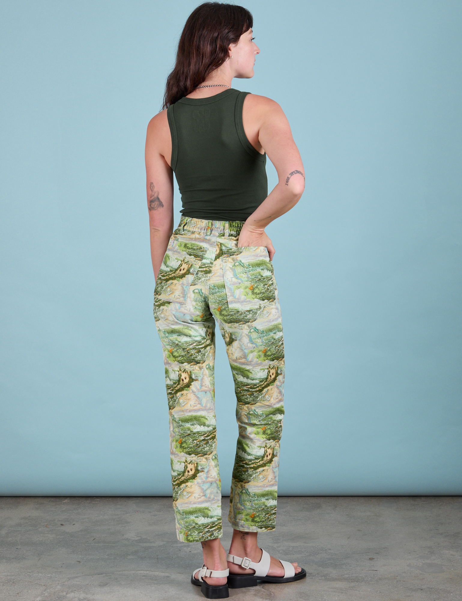 Back view of Work Pants in Ocean and Sky and swamp green Tank Top on Alex