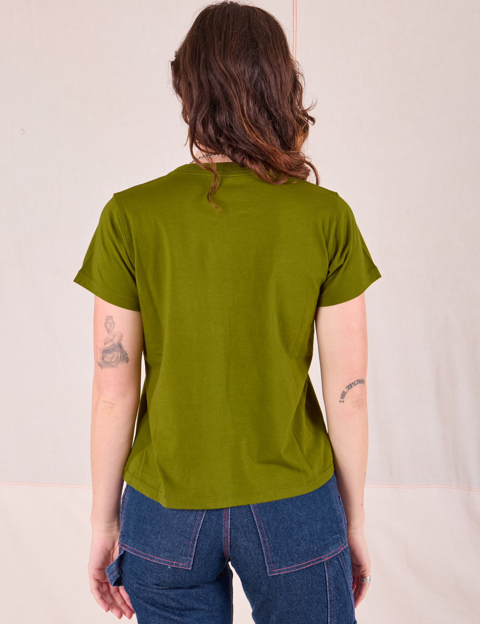 Organic Vintage Tee in Summer Olive back view on Alex