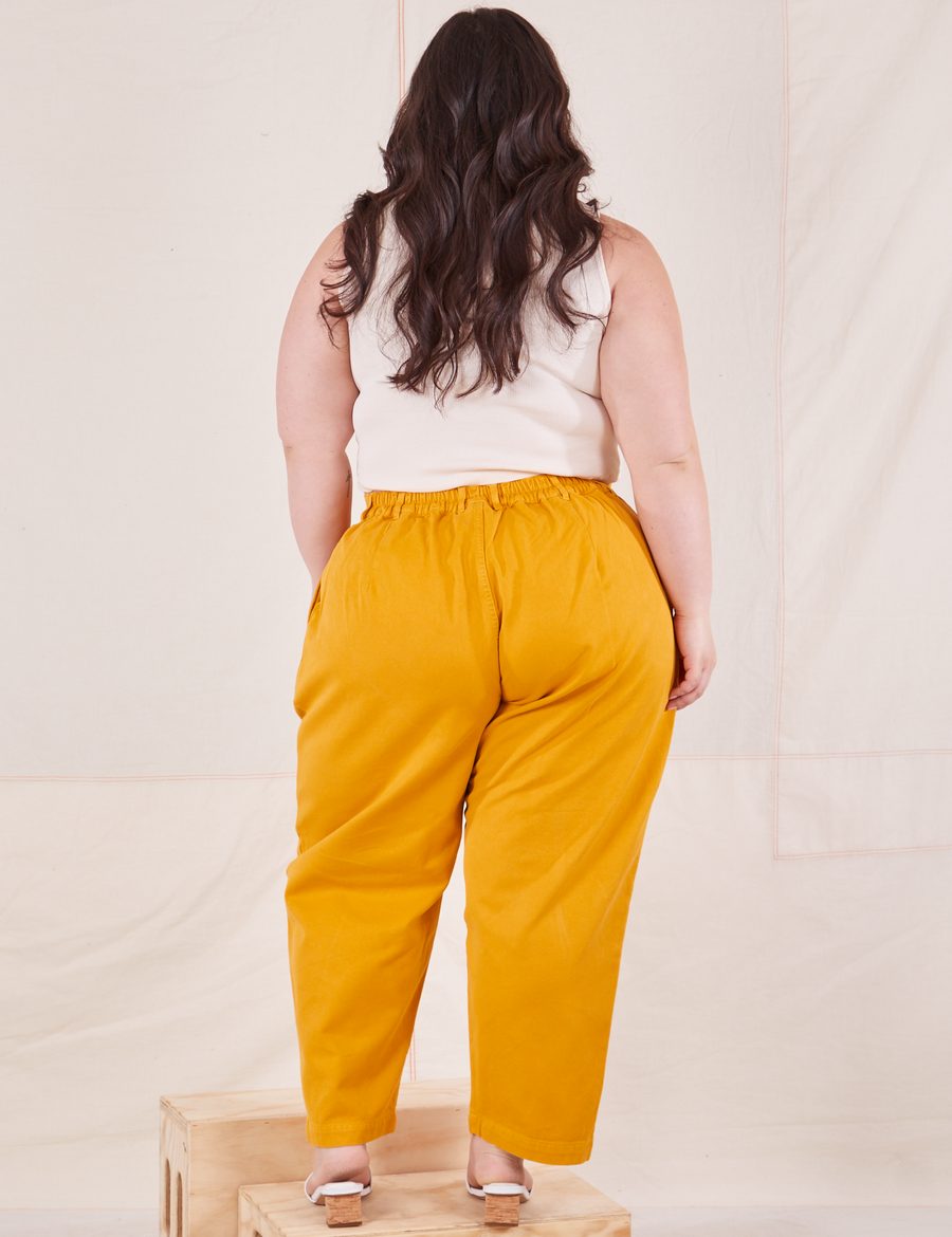 Back view of Organic Trousers in Mustard Yellow worn by Ashley
