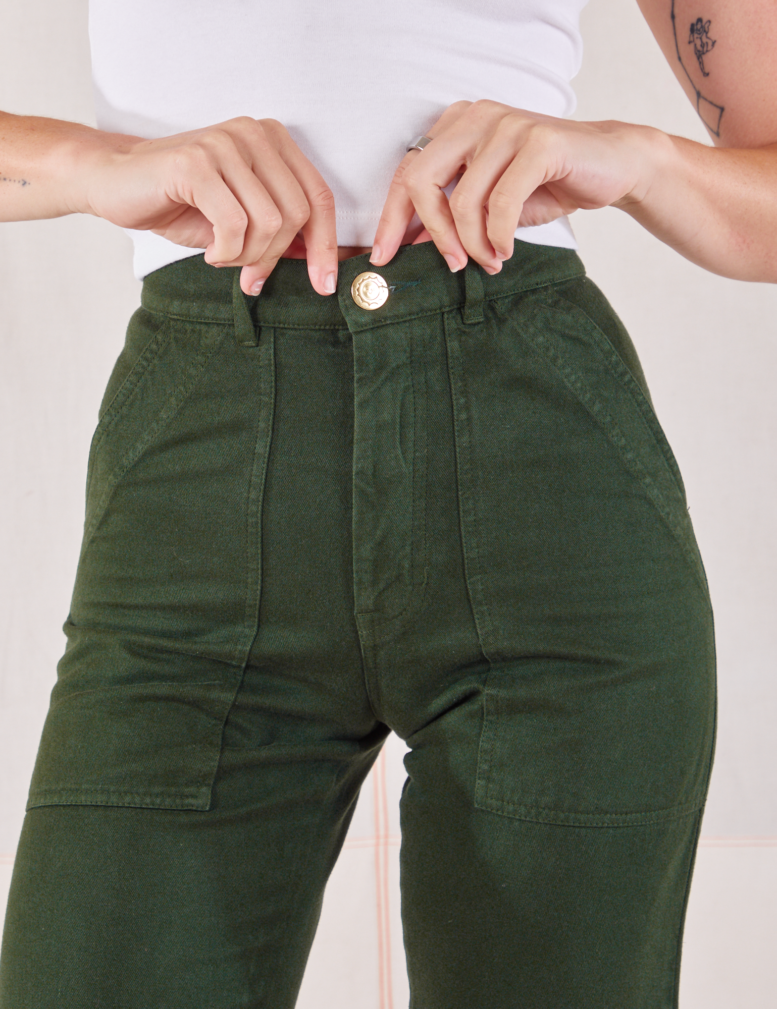 Organic Work Pants in Swamp Green front close up on Alex