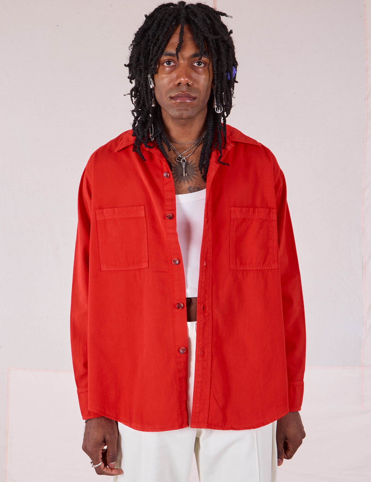 Jerrod is 6’3” and wearing S Twill Overshirt in Mustang Red