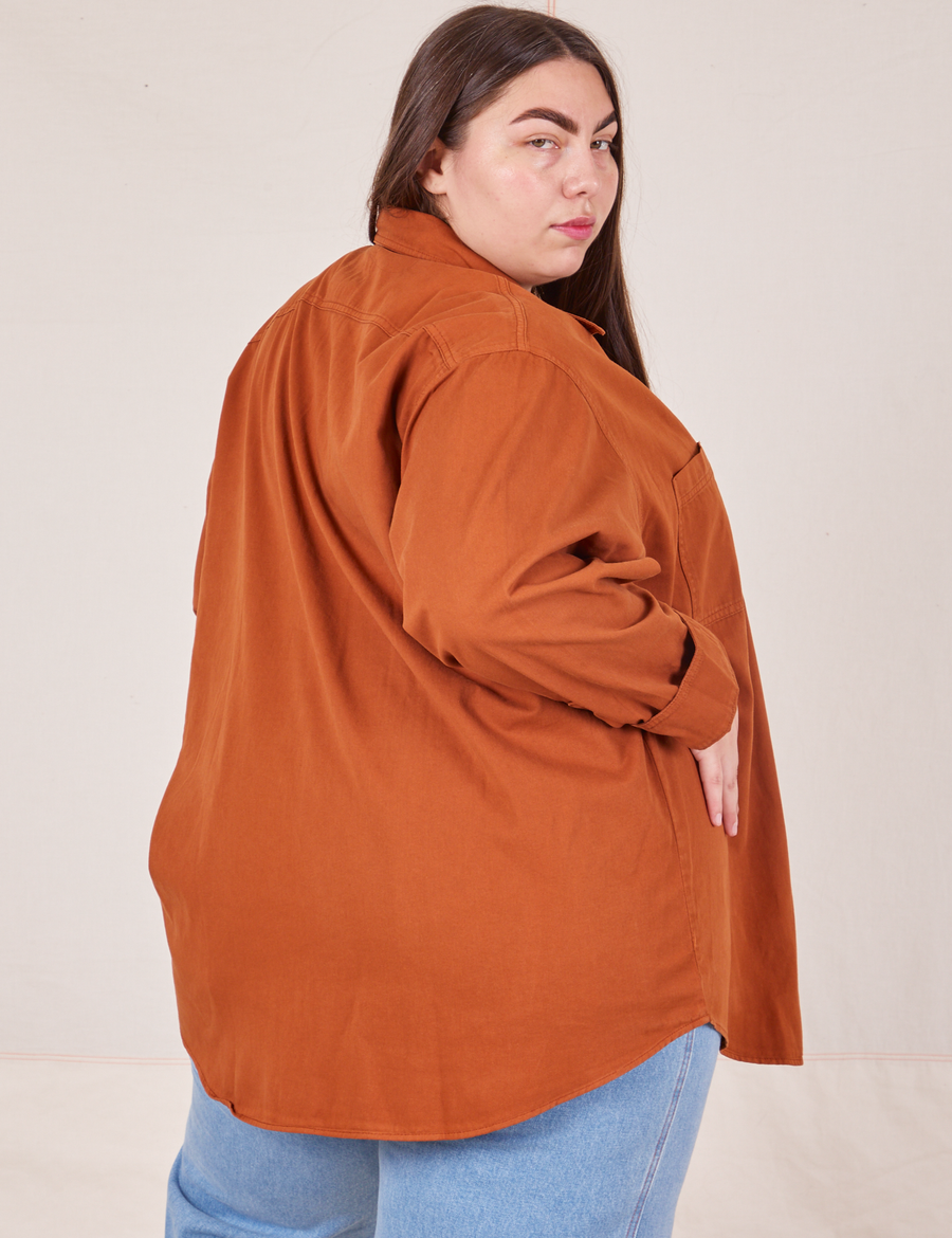 Angled back view of Oversize Overshirt in Burnt Terracotta worn by Marielena