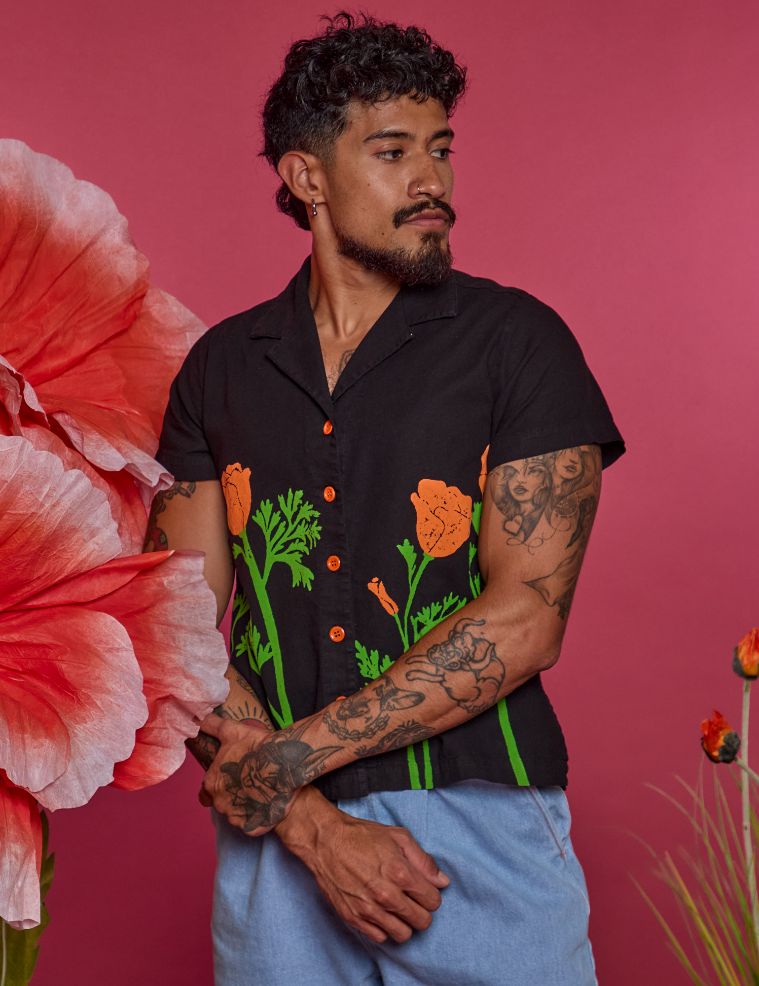 Jesse is wearing Paintstamped Pantry Button-Up in Poppy