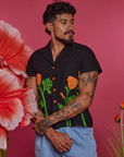 Jesse is wearing Paintstamped Pantry Button-Up in Poppy