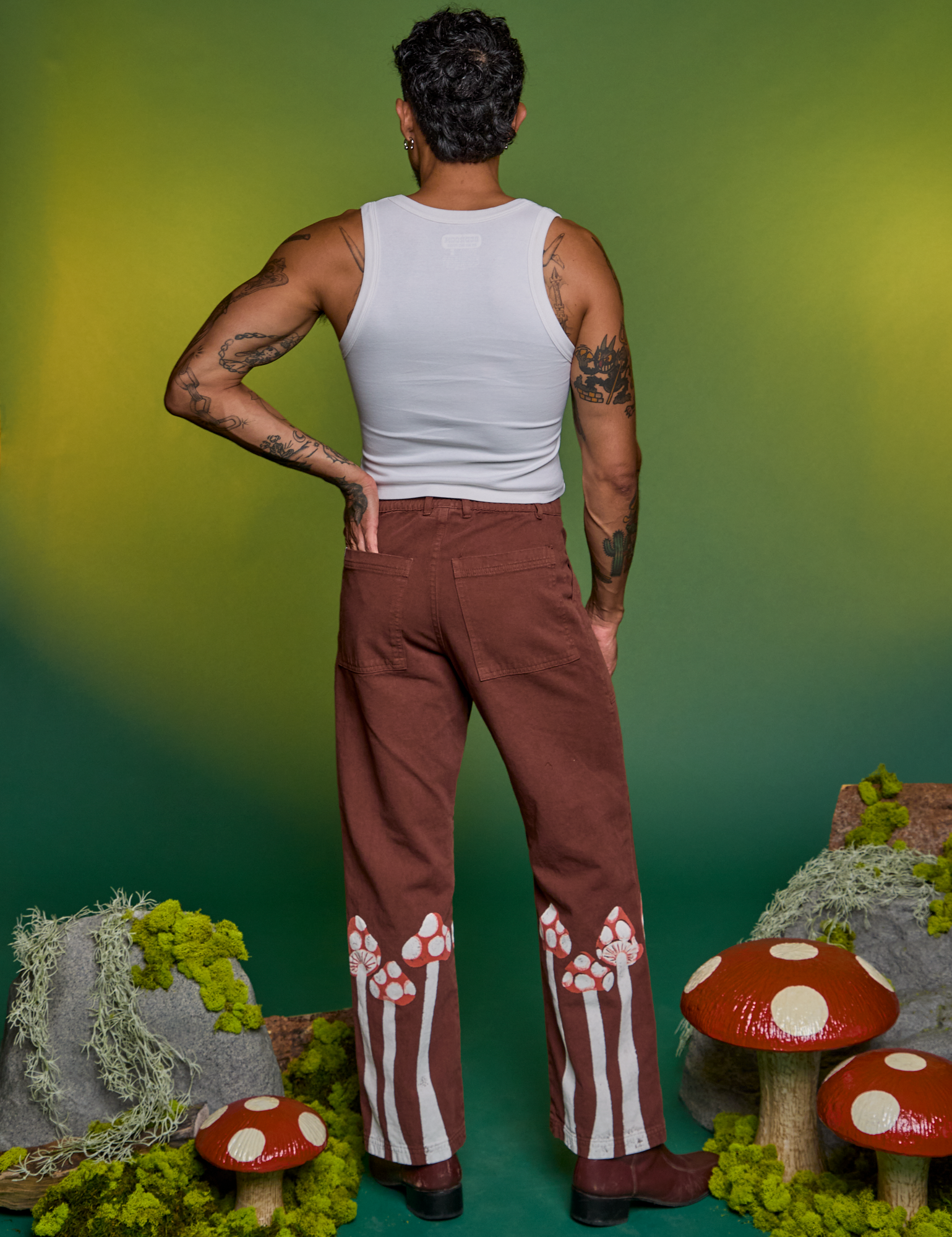 Back view of Paintstamped Work Pants in Mushroom and Cropped Tank in Vintage Tee White on Jesse