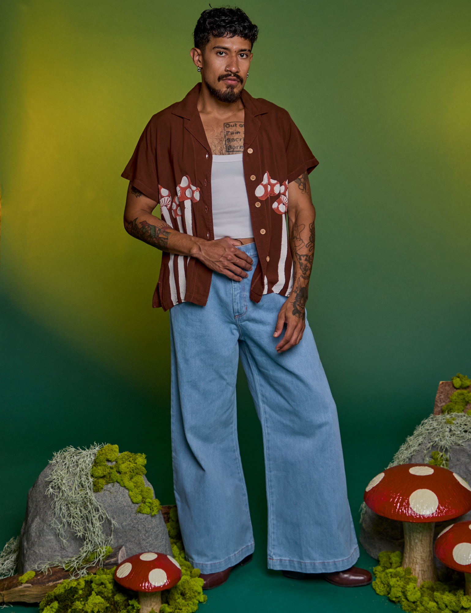 Jesse is wearing Paintstamped Pantry Button-Up in Mushroom and light wash Indigo Wide Leg Trouser