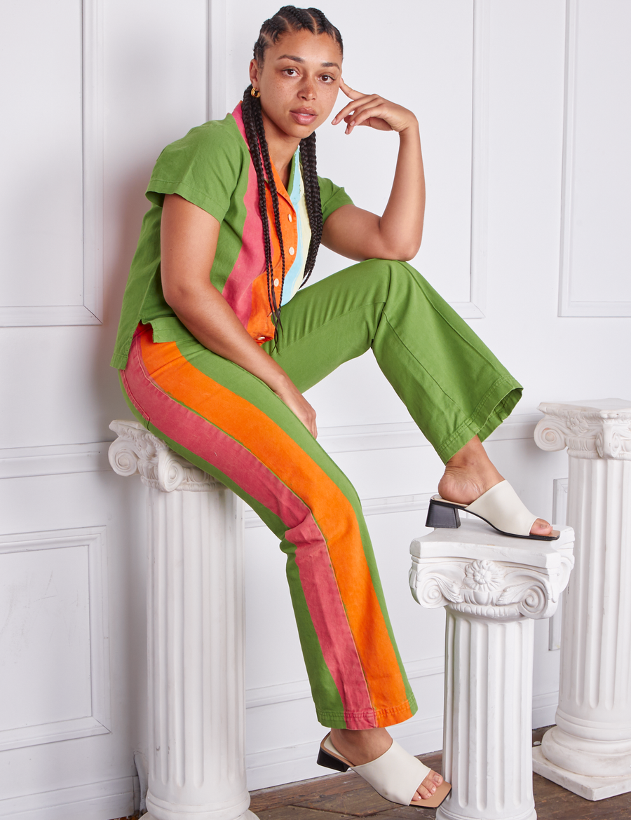 Gabi is wearing Hand-Painted Stripe Western Pants in Bright Olive and matching Pantry Button-Up