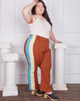 Side view of Hand-Painted Stripe Western Pants in Burnt Terracotta and vintage off-white Tank Top worn by Ashley