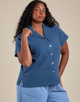 Angled front view of Pantry Button-Up in French Blue on Meghna