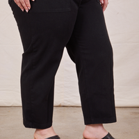 Pant leg close up of Petite Short Sleeve Jumpsuit in Basic Black worn by Ashley
