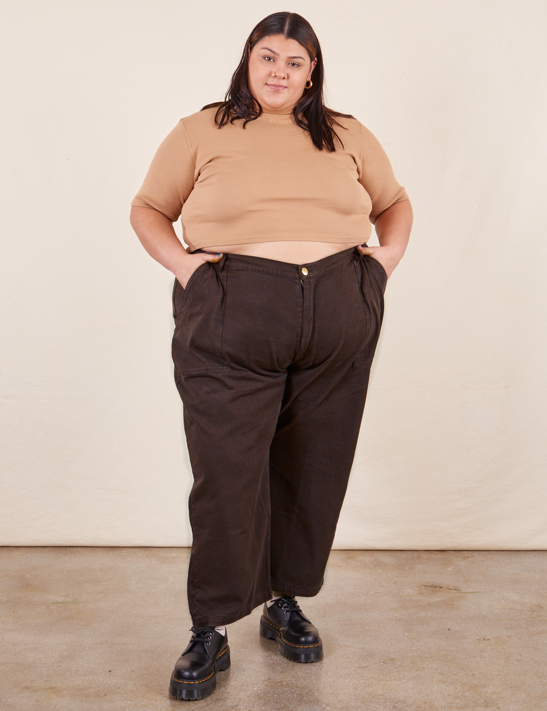 Sarita is 5'7" and wearing Petite 4XL Work Pants in Espresso Brown paired with 1/2 Sleeve Turtleneck in Tan