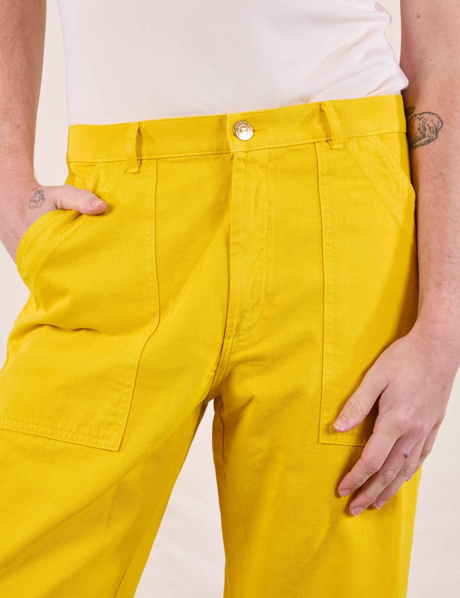 Work Pants in Golden Yellow front close up on Quinn