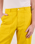 Work Pants in Golden Yellow front close up on Quinn