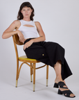 Alex wearing the Vintage Tee White Porthole Tank with Black Drop Pocket Cargo Pants