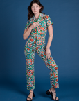 Alex is 5’8” and wearing XXS Quilt Print Jumpsuit