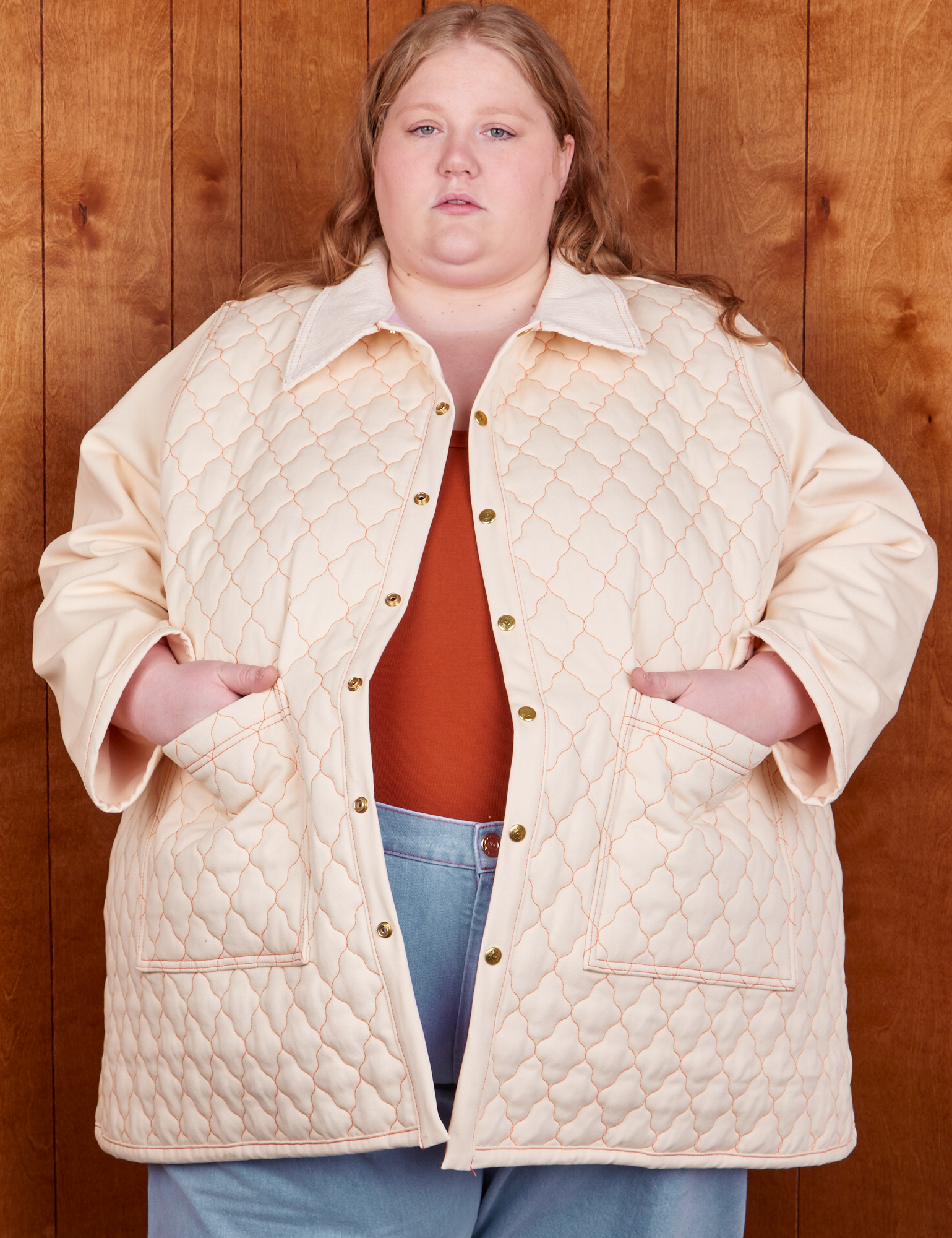 Catie is 5&#39;11&quot; and wearing 5XL Quilted Overcoat in Vintage Off-White