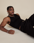 Racerback Tank in Black worn by Isaac