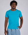 Isaac is 5’10” and wearing M Jr. Varsity Tee in Hawaiian Blue 