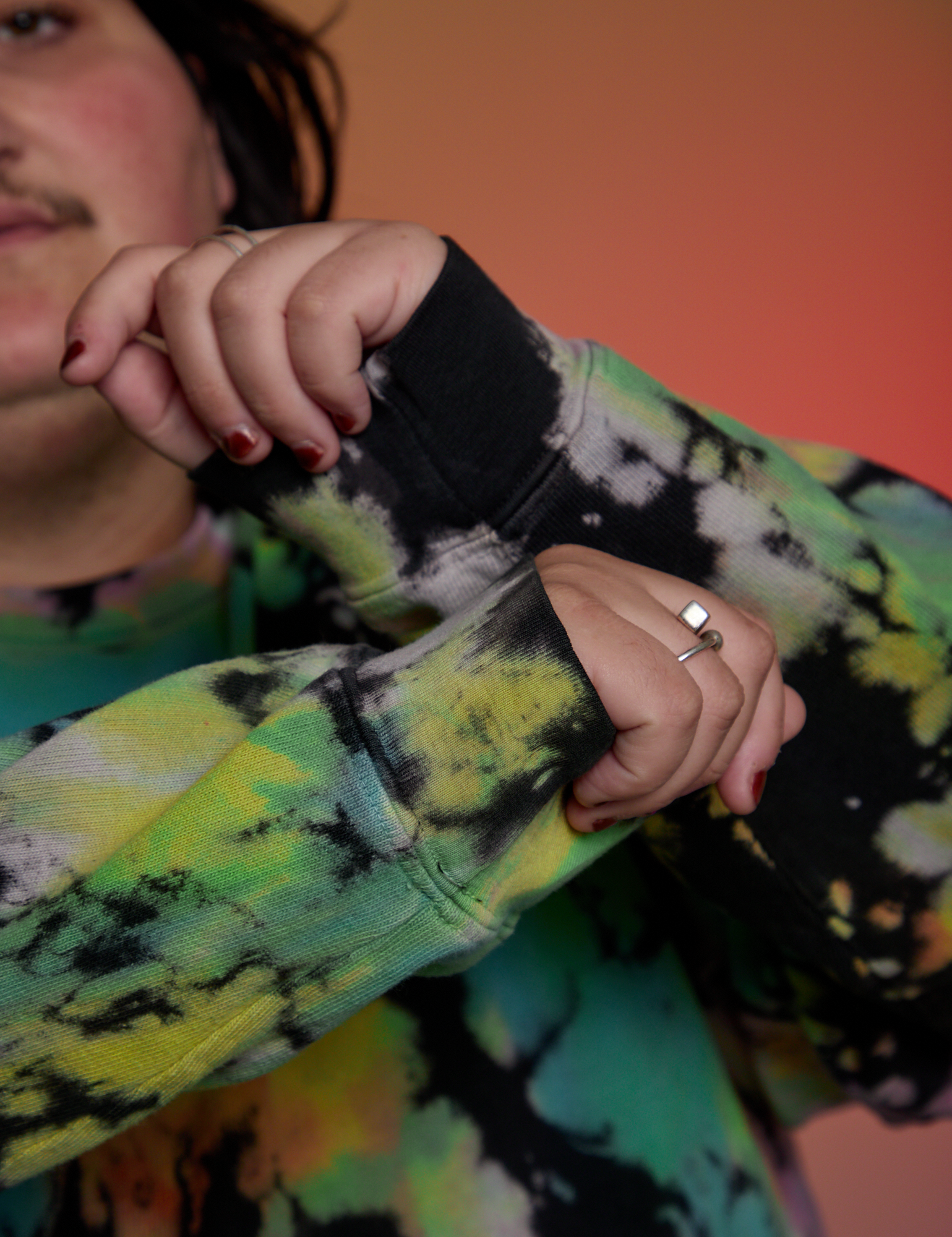 Magic Waters Long Sleeve Burly Tee in Rainbow sleeve close up on Sam