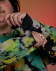 Magic Waters Long Sleeve Burly Tee in Rainbow sleeve close up on Sam