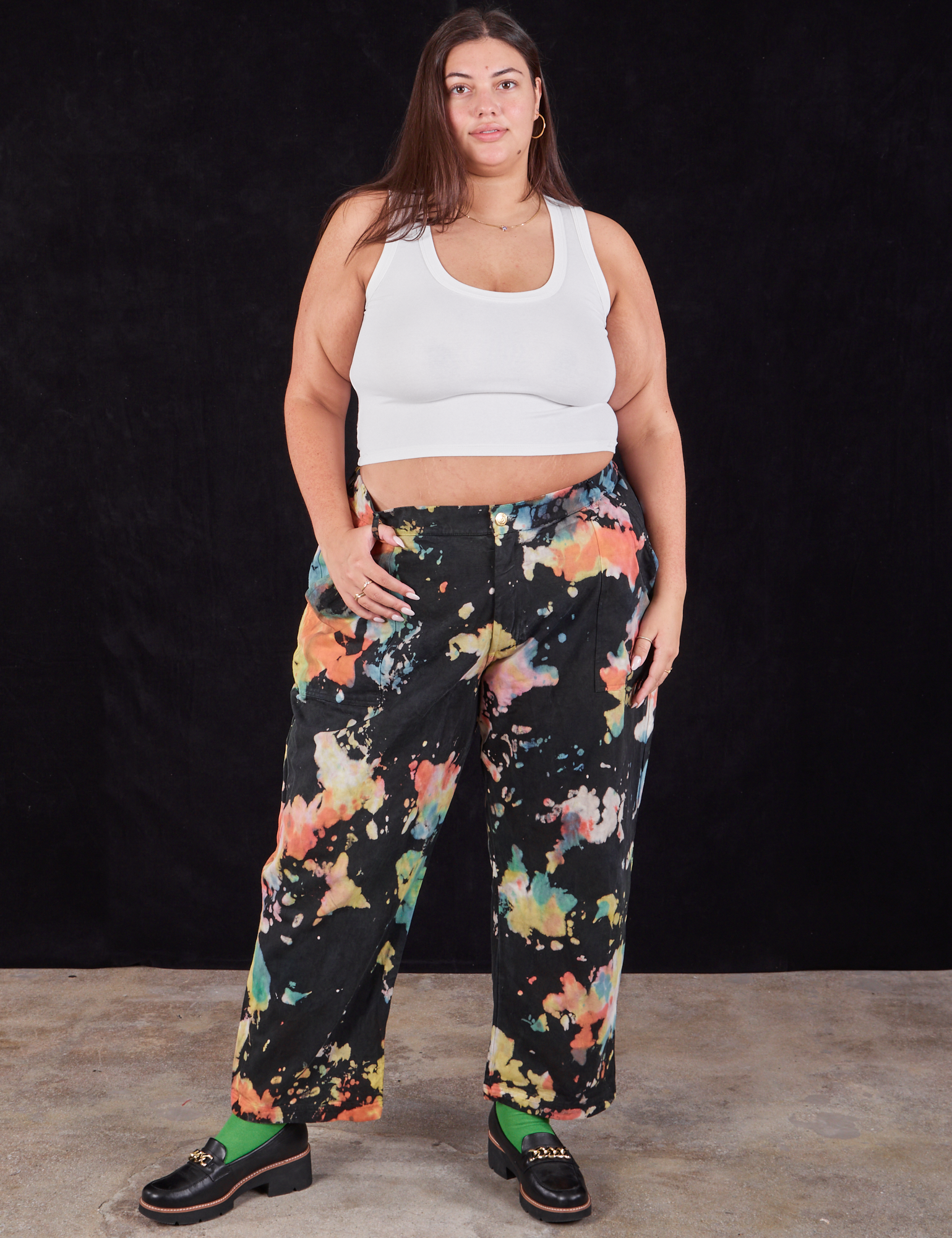 Katie is 6&#39;2&quot; and wearing 3XL Rainbow Magic Waters Work Pants paired with a vintage off-white Cropped Tank
