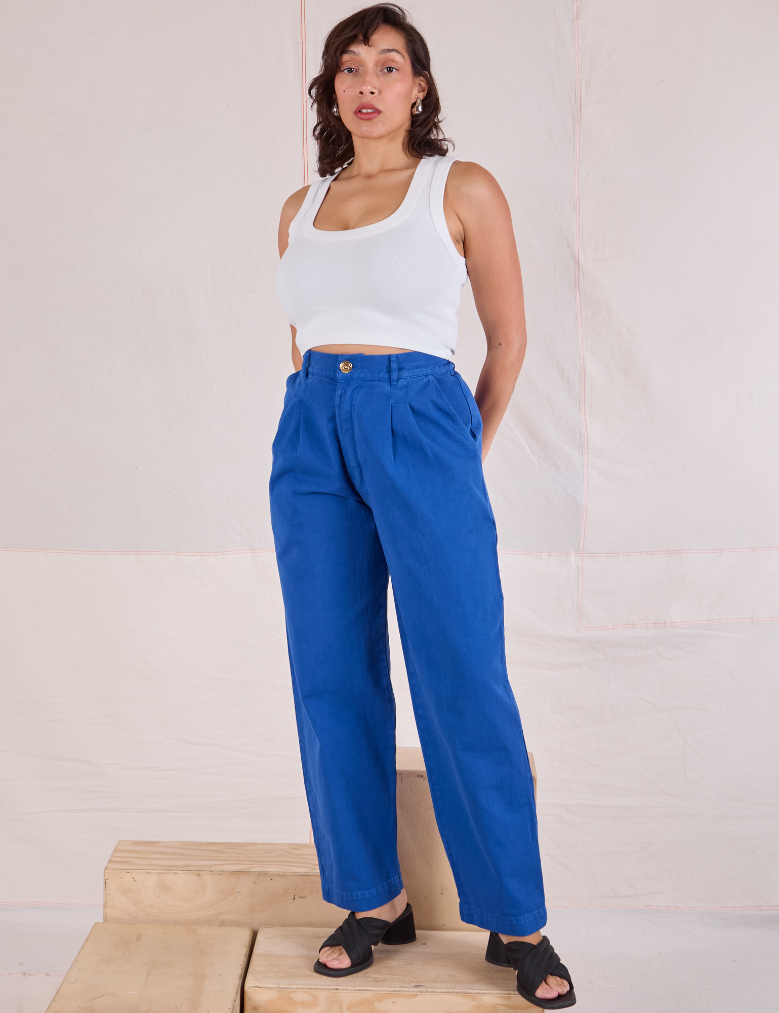 Tiara is wearing Heavyweight Trousers in Royal Blue and Cropped Tank in Vintage Tee Off-White