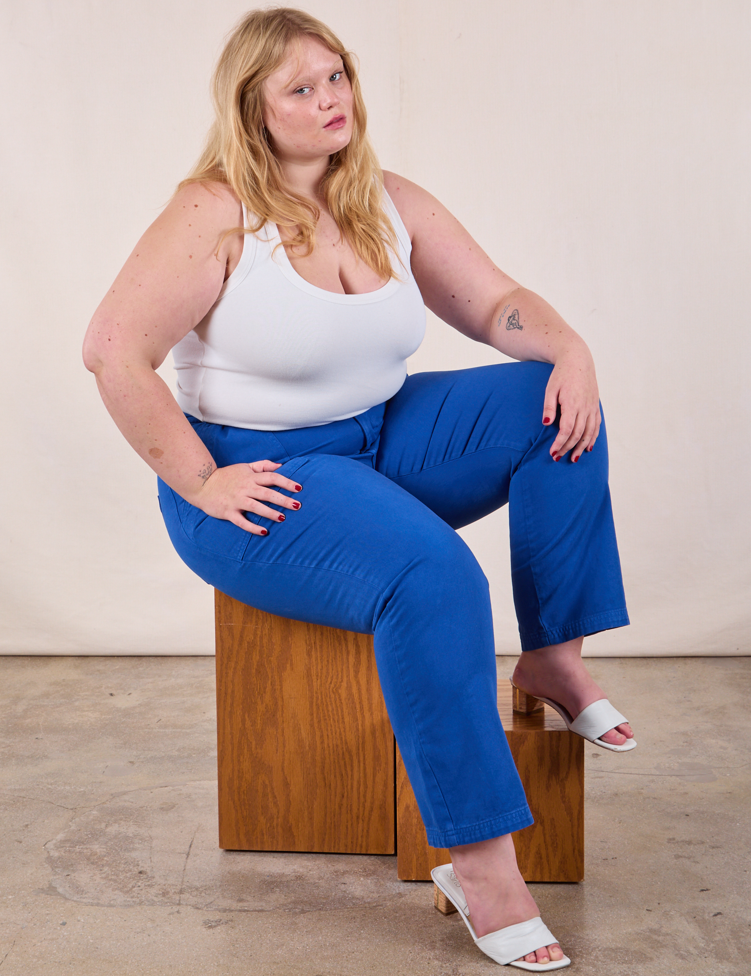 Juliet is wearing Work Pants in Royal Blue and Cropped Tank Top in Vintage Tee Off-White