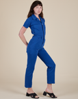 Angled front view of Short Sleeve Jumpsuit in Royal Blue on Sam