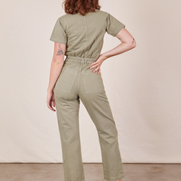 Back view of Short Sleeve Jumpsuit in Khaki Grey worn by Alex