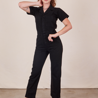 Alex is 5'8" and wearing XS Short Sleeve Jumpsuit in Basic Black