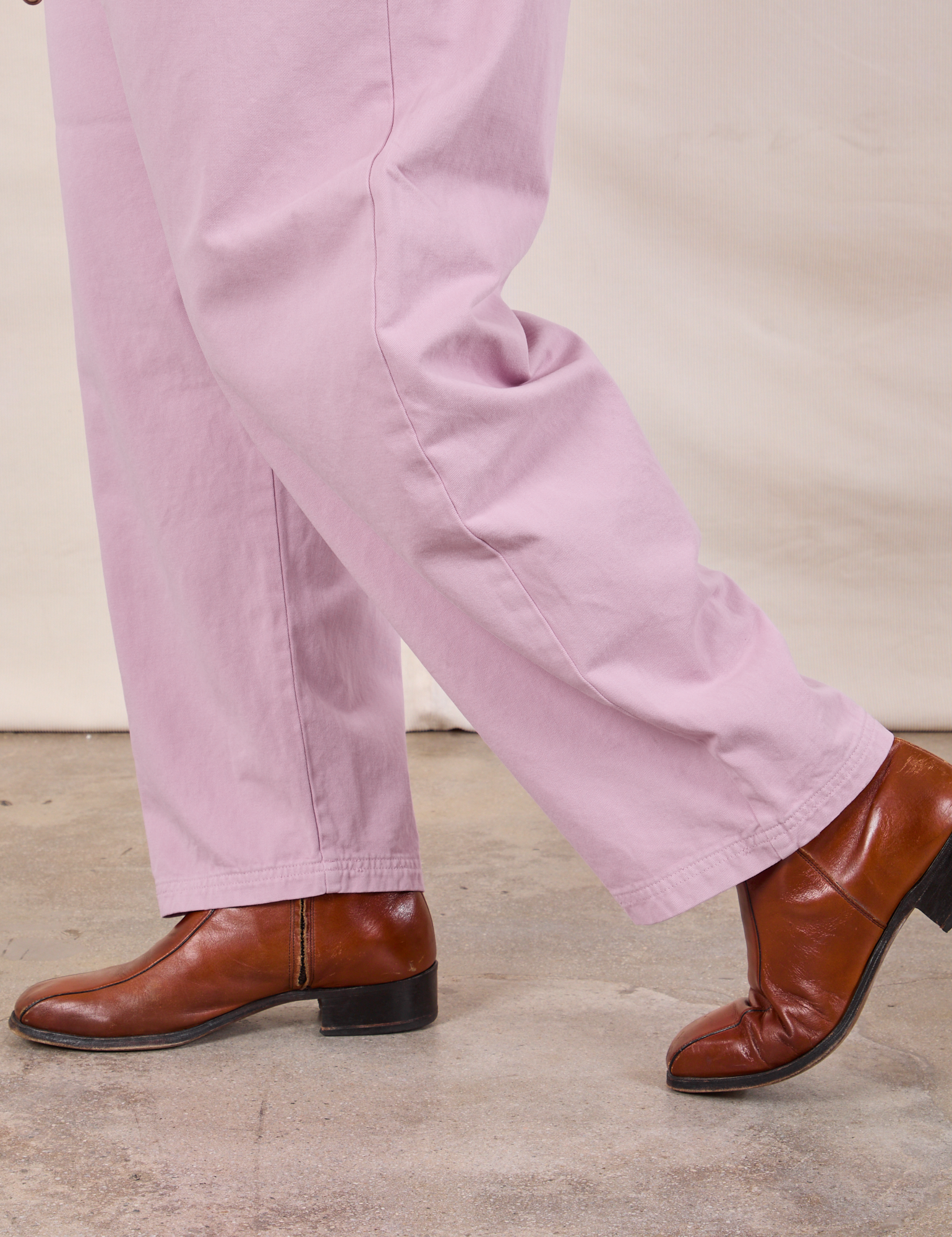 Short Sleeve Jumpsuit in Lilac pant leg close up on Miguel