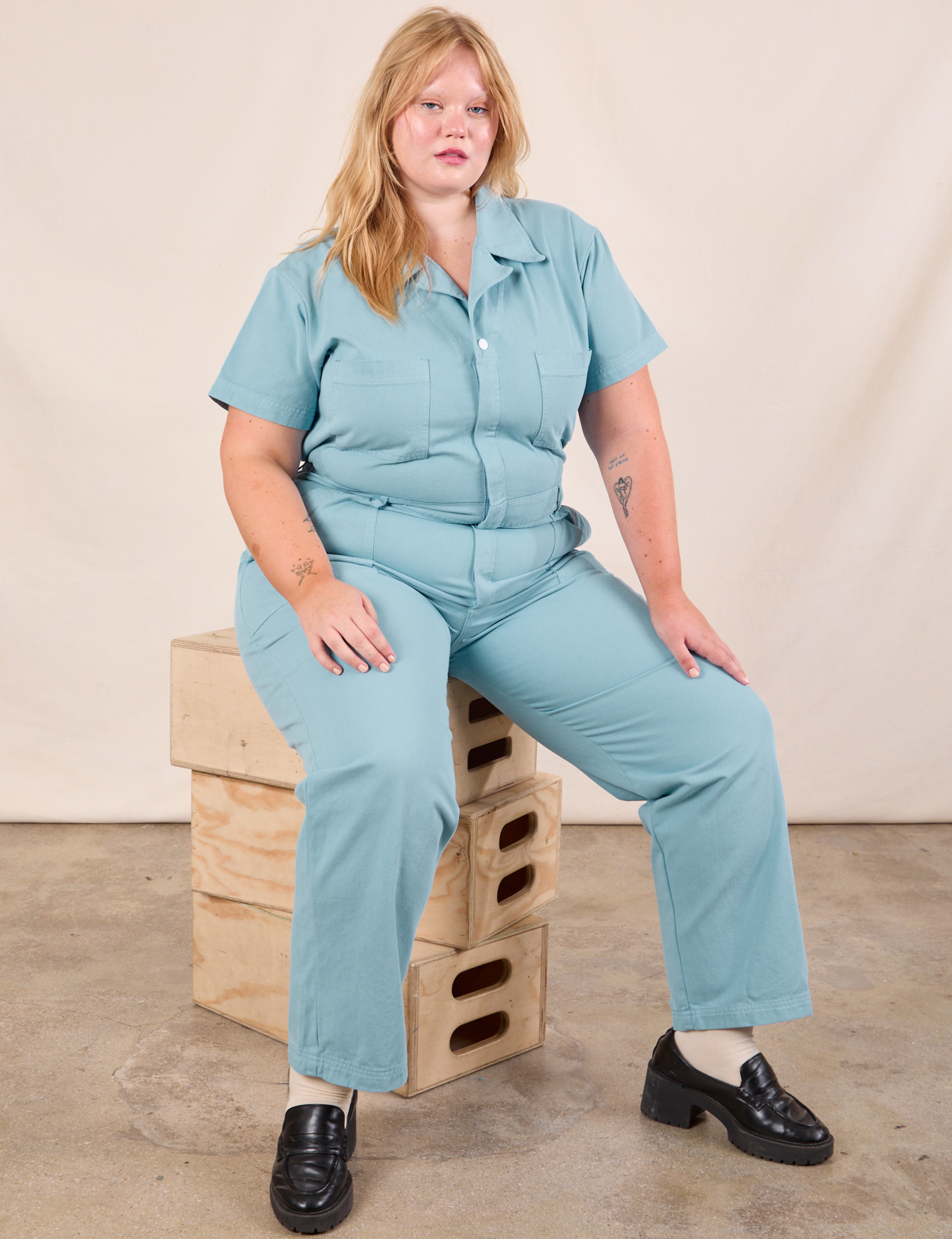 Juliet is wearing Short Sleeve Jumpsuit in Baby Blue