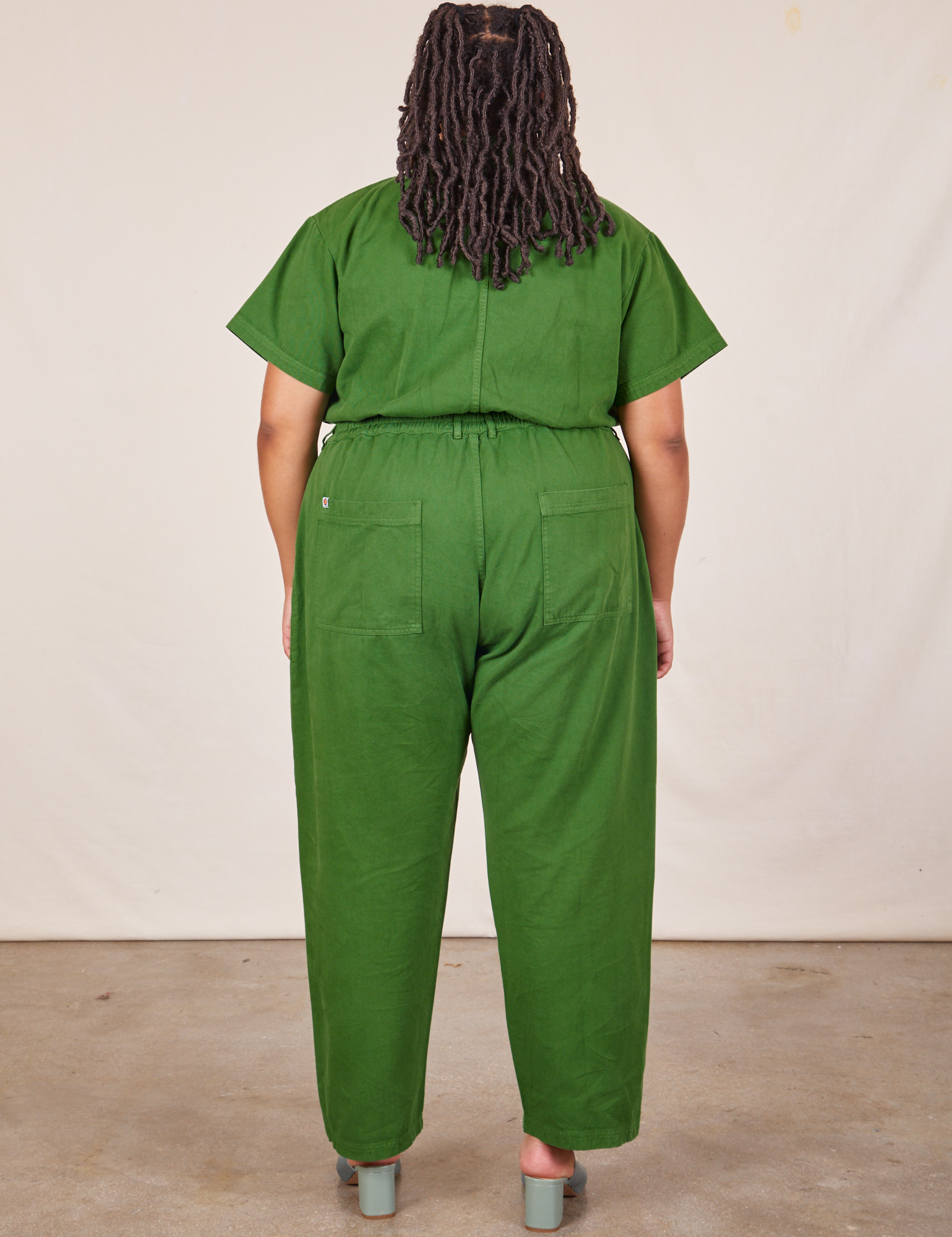 Back view of Short Sleeve Jumpsuit in Lawn Green worn by Alicia