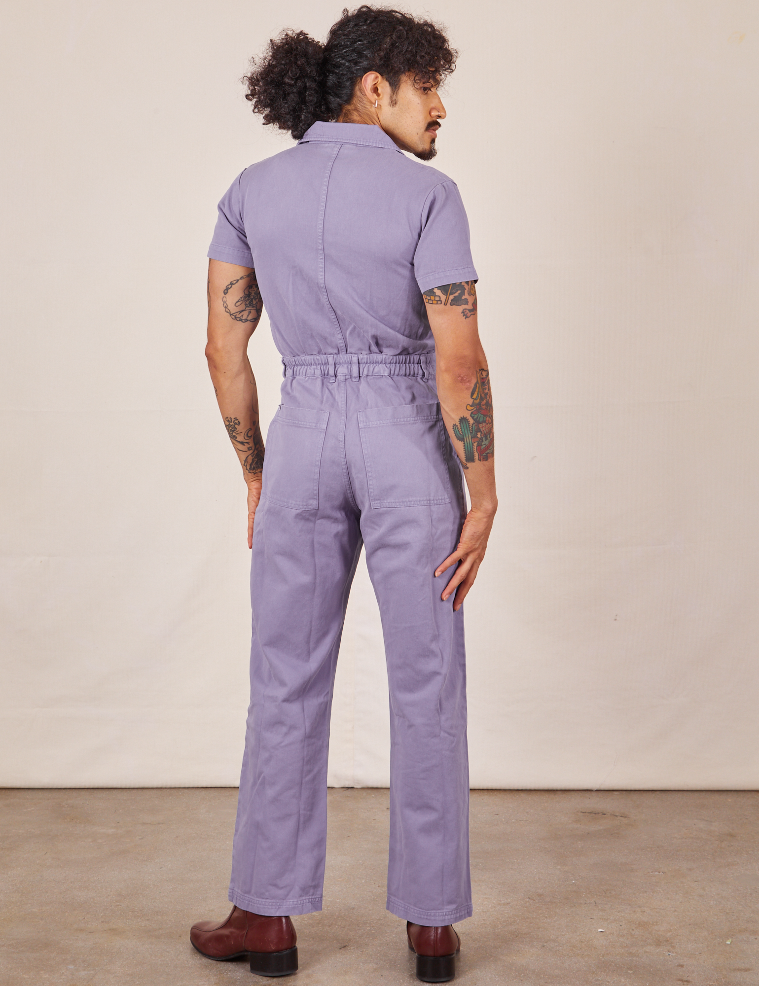 Back view of Short Sleeve Jumpsuit in Faded Grape worn by Jesse