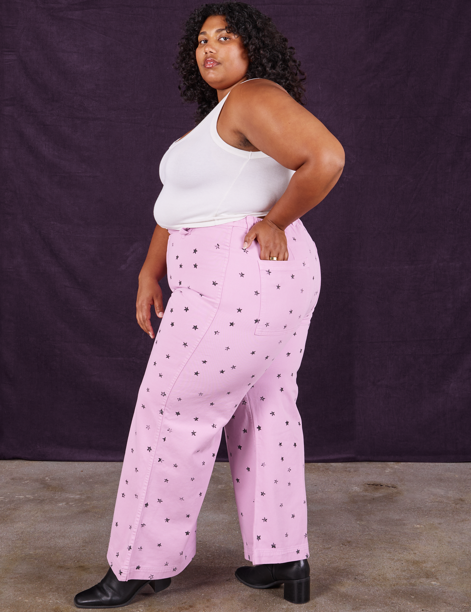 Side view of Star Bell Bottoms in Lilac Purple and Cropped Tank in vintage tee off-white on Morgan