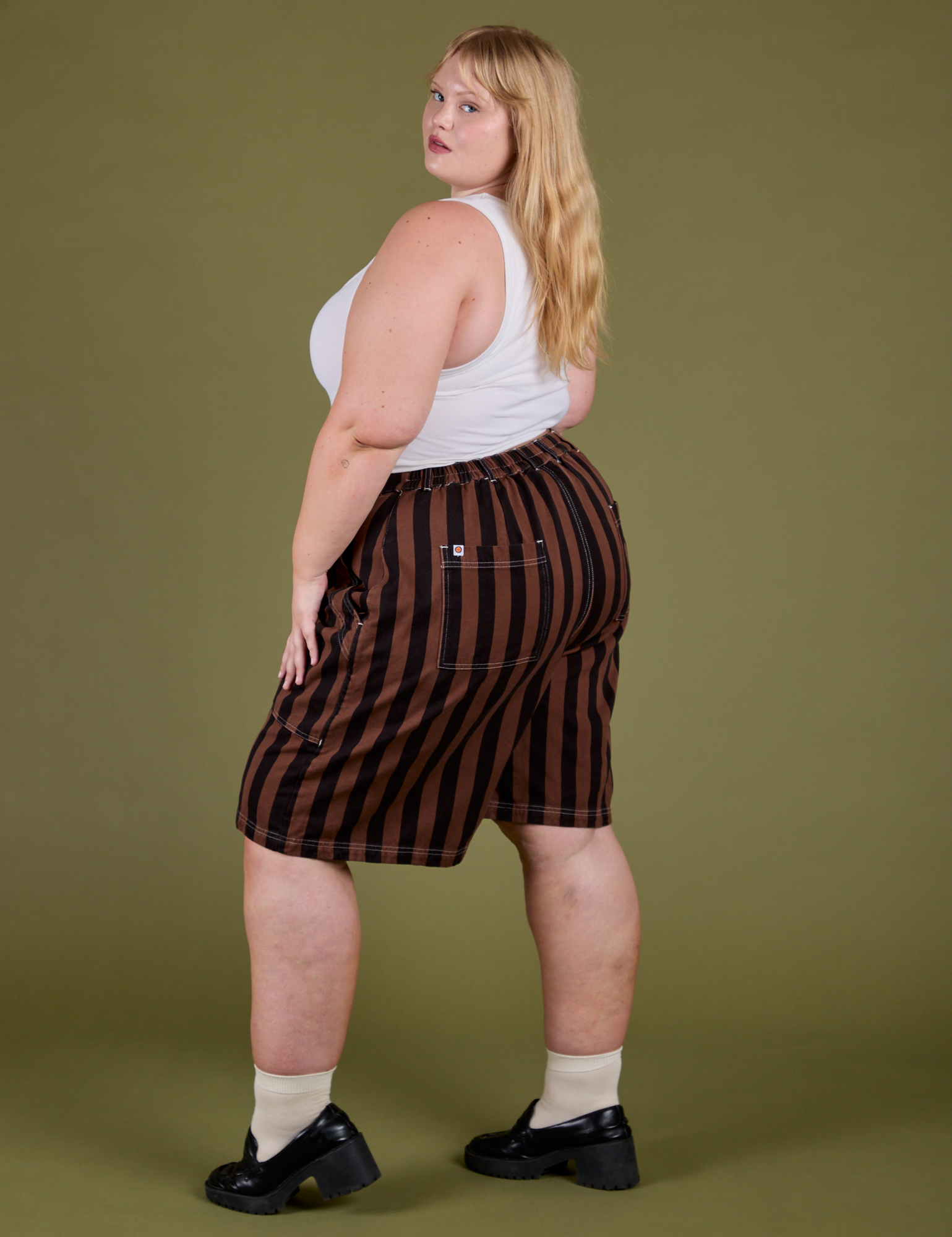 Longline Work Shorts in Fudgesicle Brown angled back view on Juliet