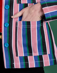 Close up of Alex's hand in the front pocket of Stripe Work Jacket in Pacific Stripe